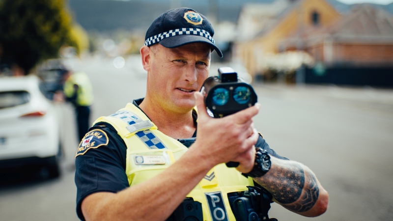 Police Constable holding speed radar